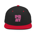 A black flat-brim baseball cap with a red visor, red button on top, and a pink graphic on the front that reads 'PRAY'.